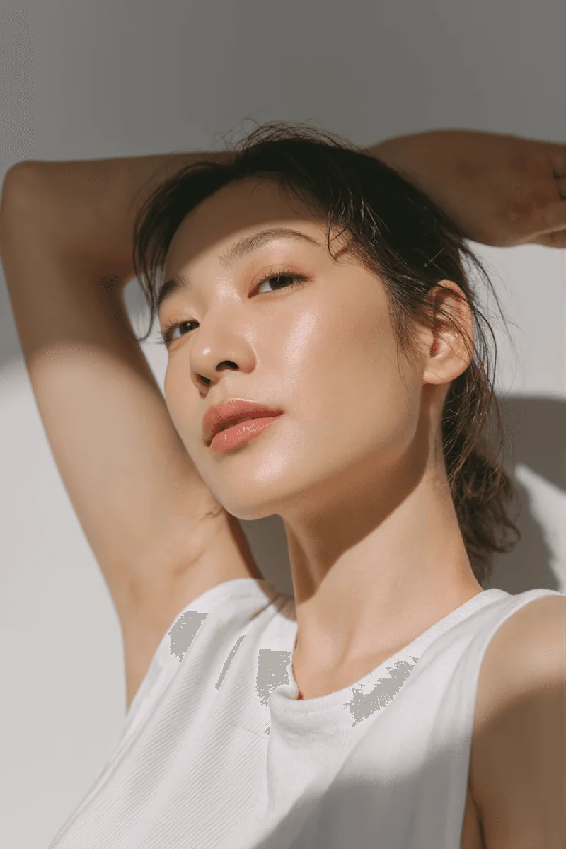 Woman in a white top in soft natural sunlight